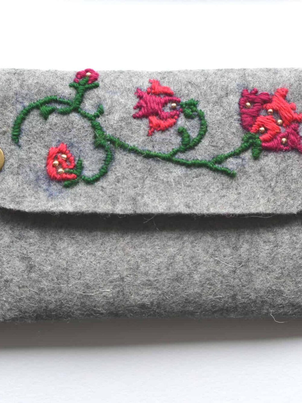 hand-embroidered felt clutch bag