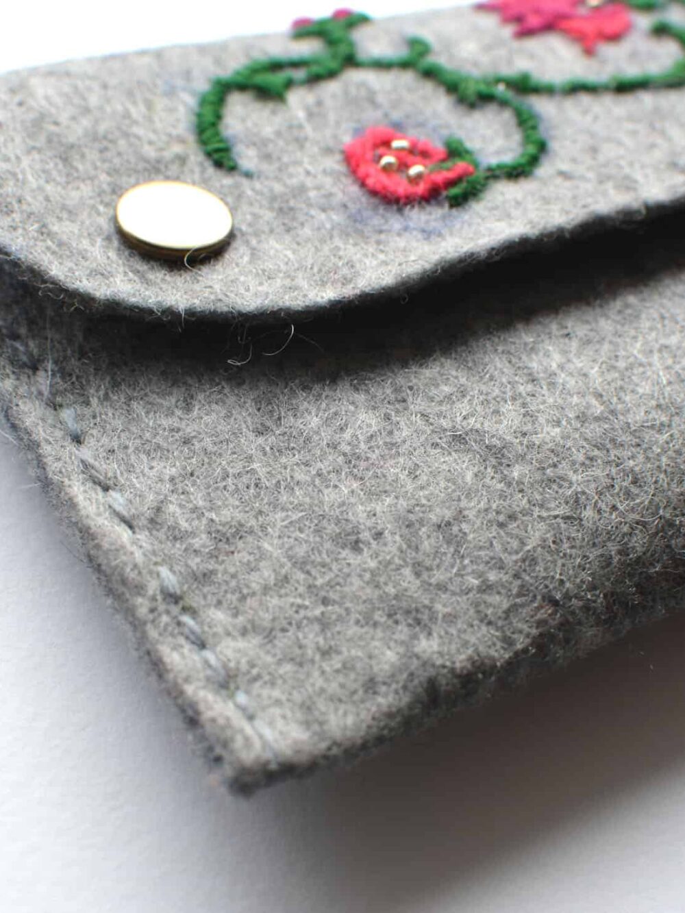 hand-embroidered felt clutch bag
