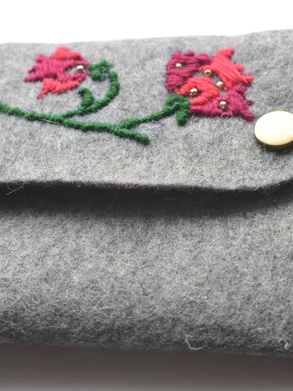 hand-embroidered felt clutch bag