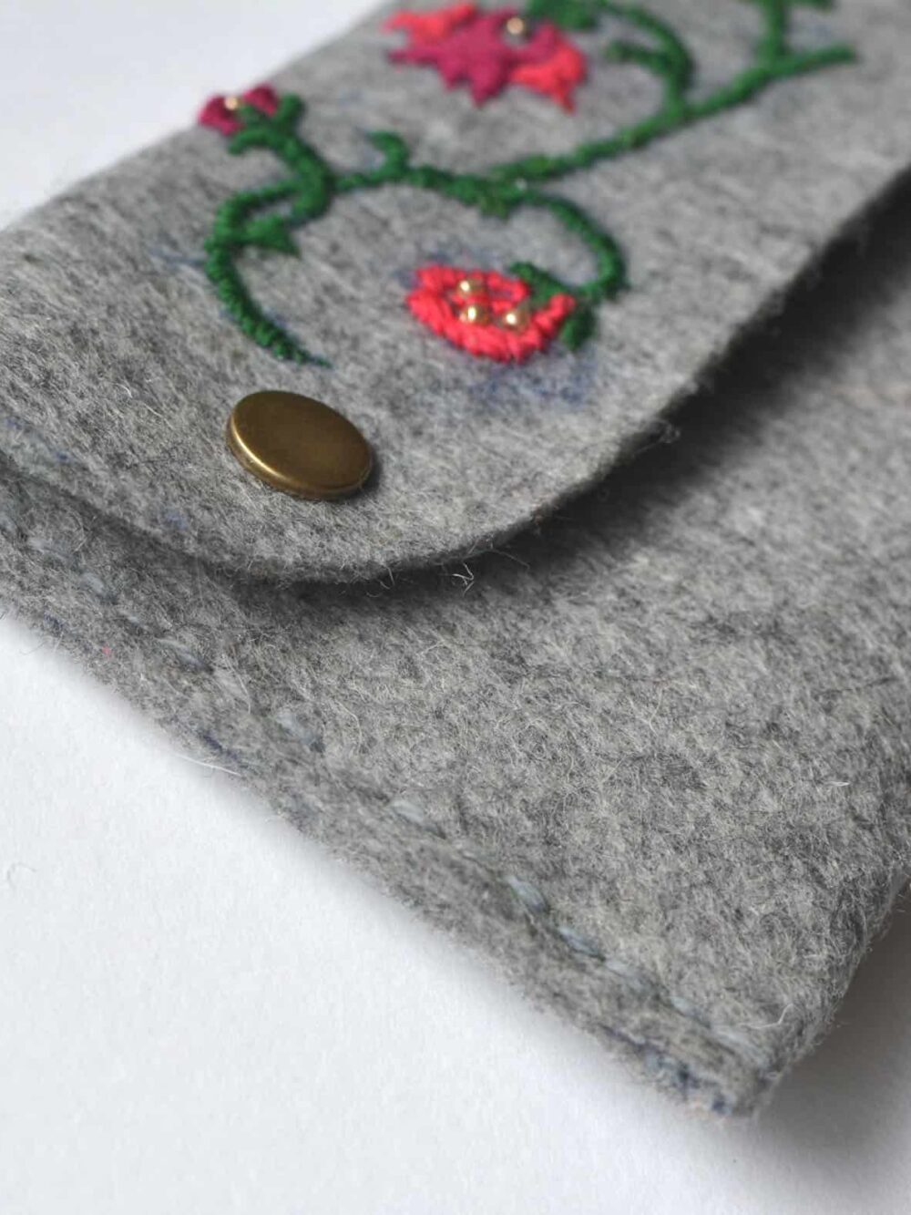 hand-embroidered felt clutch bag