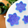 Enhance your home with this set of three Persian copper enamel  (Minakari) star dishes, hand-painted with intricate floral designs in vibrant blue,